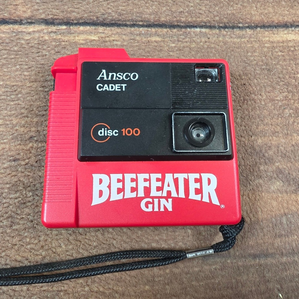 Ansco Cadet Disc 100 Camera Mens OS Red Excellent Beefeater Gin Promotional 80s